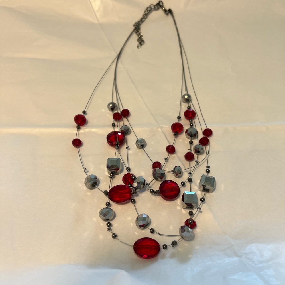 Floating necklace with red gems and silver cubes & balls. Lobster clasp